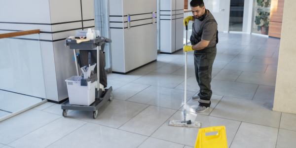 full-shot-man-cleaning-office-floor-1024x683